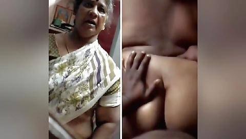 Indian granny in a black dress shows off her big boobs