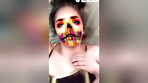 Indian brunette wearing a mask and playing with her big cock