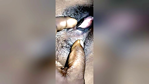 Amateur video shows a girl with hairy pussy licking