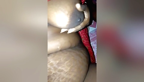Indian teacher shows a girl how to do the best she can