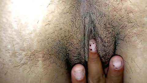 Indian babe shows off her hairy pussy and pussy lips
