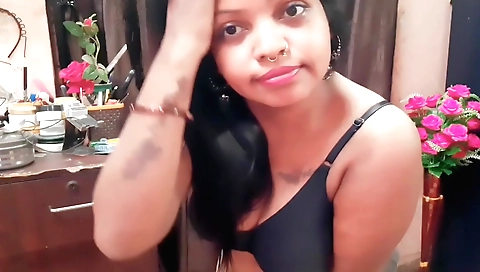 Amateurs in white blouse and a black dress is showing her body