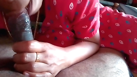 Indian brunette sucks and fondles her cock in her mouth