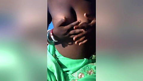 Busty bitch with a big ass and a big cock is fucking herself