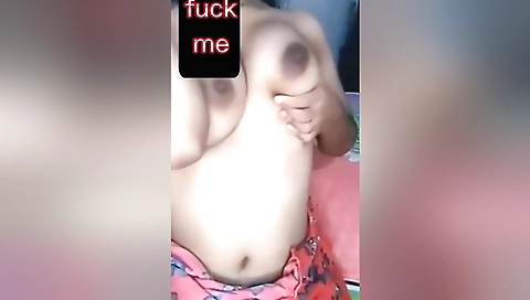 Horny brunette in black dress fucks herself on webcams