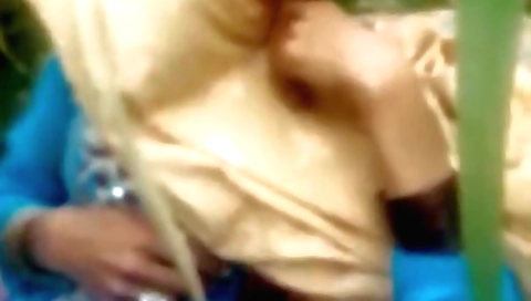 Indian woman with big boobs and long legs outdoors