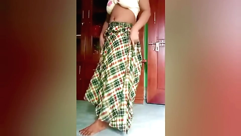Indian girl dances on bed and plays with her fingers