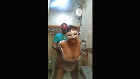Indian brunette chick showing her big tits in the shower