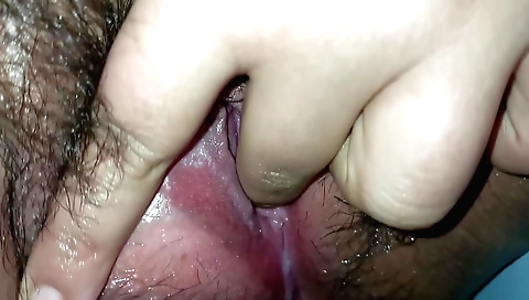 Hairy ebony woman enjoying an intimate solo blowjob