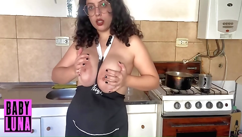 Sexy amateur brunette enjoys her cooking in the kitchen